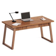 a laptop computer sitting on top of a wooden desk next to a lamp and cup