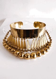 Vintage Adjustable Choker Necklace, Adjustable Gold Choker Jewelry, Adjustable Gold Metal Choker, Gold Adjustable Choker, Unique Adjustable Metal Choker, Unique Adjustable Brass Choker, Festival Costume Jewelry Choker, Gold Costume Jewelry For Festival, Nickel-free Choker Necklace