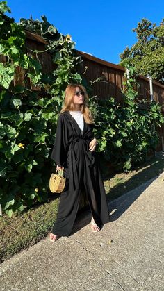 "Black Oversized Kimono, Hand black kimono robe, Long unisex robe, Black Kimono, boho robe, Beach Coverup, gift for her Name: Black Swan kimono robe  - Beautiful handcrafted kimono robe - Sizes: One size -Oversize all fit 👈🏽 - Chest & Hip: 60 inches. Length: 55inches. 👈🏽 - Removable waist tie closure/belt - Side slits at hem - two POCKETS😊 - 100% Soft Rayon, lightweight - Hand wash in cold water, hang dry. - You can wear it at the beach, or even from day till night on your holidays! It's also suitable for relaxing moments at home - At first, you may feel the material is not so soft as described or may have some strange smell because of the process. But the difference will be visible after the first wash. You will get soft and super comfy ready-to-go wear. -Ethically made 🙌🏽 fairly t Black Bohemian Kimono For Beach Cover-up, Black Long Kimono For Beach Cover-up, Oversized Long Sleeve Abaya For The Beach, Summer Vacation Abaya With Kimono Sleeves, Elegant Black Loungewear Kimono, Black Long Sleeve Kimono For Beach, Casual Black Wrap Kimono, Elegant Black Kimono For Loungewear, Black Oversized Kimono For Spring