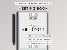 the front cover of a meeting book with a pen next to it and an empty notepad