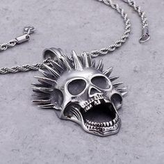 Even the dead have their dose of madness. This punk necklace with an eccentric cut is perfect for those who aren't afraid of other people's gaze! This punk skull necklace is a must for punk people, for people fond of Blink-185 or even Sum 41. As you may have noticed, it is totally painted in silver, making this necklace a unique and really attractive jewel for punk people and their black outfits. Also, as you can see, it has a foxtail bead attached to a screaming skeleton head with punk liberty Gothic Necklace For Halloween Concert, Punk Necklaces For Halloween Concert, Punk Style Necklaces For Halloween Concert, Punk Style Jewelry For Halloween Concert, Alternative Style Necklaces For Halloween, Alternative Halloween Necklaces, Alternative Halloween Necklaces For Alternative Fashion, Alternative Necklaces For Halloween Concert, Emo Necklaces For Halloween And Alternative Fashion