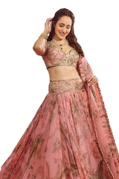 Pink lehenga with all over floral garden prints, elevated with an embroidered broad waistband using sequins, mirror. Paired with a blouse with printed base and sequin, mirror embroidery. Comes along with a dupatta with floral, sequin embroidered buttis. - Aza Fashions Wedding Sharara With Floral Print For Navratri, Floral Print Sets For Wedding And Navratri, Navratri Wedding Floral Print Sets, Floral Print Wedding Sets For Navratri, Floral Wedding Sets For Navratri, Fitted Floral Print Sharara For Navratri, Floral Print Traditional Drape Sets For Reception, Wedding Choli With Floral Print And Traditional Drape, Wedding Floral Print Choli With Traditional Drape