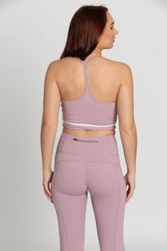 Our Mauve Mist White Line Crop Tank is the perfect addition to your athleisure collection. Featuring a white line detail, sleek Y-Back design, and sweat wicking material, this tank effortlessly takes you from your workout class to brunch with the girls. Pilates Princess, Tennis Skirts, White Line, Athletic Top, Yoga Tops, Crop Tank, Model Height, Bra Tops, Athleisure