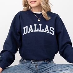 This Dallas sweatshirt is the perfect way to embrace the iconic Dallas skyline. Crafted with premium materials, this cozy Dallas crewneck offers both comfort and a touch of casual style. Whether you're taking in the city's impressive architecture, enjoying local attractions, or simply expressing your love for Dallas, our Dallas shirt is the ideal choice. Ideal for most situations, a unisex heavy blend Texas crewneck sweater is pure comfort. These garments are made from polyester and cotton. This combination helps designs come out looking fresh and beautiful. The collar is ribbed knit, so it retains its shape even after washing. There are no itchy side seams on these sweaters. - 50% cotton, 50% polyester - Medium-heavy fabric (8.0 oz/yd² (271.25 g/m - Loose fit - Sewn-in label Fit Note: If Fall Crew Neck Hoodie With Logo Print, College Logo Print Crew Neck Sweatshirt, Trendy French Terry Tops For College, Collegiate Crew Sweatshirt For Fall, Relaxed Fit Crew Sweatshirt For Campus, Relaxed Fit Crew Sweater For Campus, Collegiate Fall Fleece Sweater, Varsity French Terry Crew Neck Sweatshirt, Collegiate Fleece Sweater For Fall