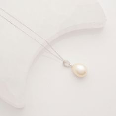 There is nothing more timeless & elegant than Freshwater pearl jewellery and this necklace is a must have classic. Created using a cultured fresh water pearl that has been carefully selected for its quality and beauty. It is set in a stunning sterling silver setting that adds a touch of sophistication to the piece. The necklace is completed with a delicate chain that is both durable and stylish, created with eco-friendly sterling silver reducing the environmental impact of silver mining and work Formal Akoya Pearl Necklace With Pear Shape, Formal Akoya Pearl Pear-shaped Necklace, Formal Akoya Pearl Pear Shaped Necklace, Formal Pear-shaped Akoya Pearl Necklace, Teardrop Akoya Pearl Necklace With Pendant, Teardrop Akoya Pearl Drop Necklace, Akoya Pearl Teardrop Pendant Necklace, Refined Pearl White Necklace With Pearl Drop, Graceful Pearl Drop Necklace