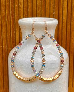 "🔥Description:  These beautiful multicolored faceted glass beaded drop earrings are breathtaking! The amount of sparkle these earrings give off is just captivating even in such a small dainty piece. These are truly summer earrings that would look great on the beach or at an out door party as the sun shines on them These earrings could be worn in a formal setting especially with something sparkly or an informal setting to stand out. The natural, earthy look of the gold plus the sparkle of the fa Gold Dangling Beads Earrings For Summer, Summer Dangling Bead Teardrop Earrings, Colorful Beaded Metal Drop Earrings, Summer Gold Beads Drop Earrings, Handmade Beaded Earrings Ideas, Out Door Party, Unique Colorful Beads Drop Earrings, Etsy.com Etsy, Handmade Earrings Ideas