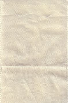 a piece of white paper with stitching on it