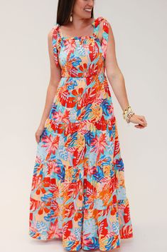 Look absolutely stunning on your next vacay with this From Coast to Coast maxi dress! It's eye-catching tropical print smocked ruffle tiered design is sure to make you the envy of the beach. Plus, with sizes S to XL, you can find the perfect fit for your coast-to-coast adventures! Wanna turn heads? Just add sand! **FS** Flowy Tiered Maxi Dress For Vacation, Tropical Sleeveless Beach Dress For Brunch, Sleeveless Tropical Beach Dress For Brunch, Beach Tiered Sundress With Smocked Back, Beachwear Maxi Dress With Smocked Back For Vacation, Summer Tiered Maxi Dress For Beach Season, Tiered Sundress With Smocked Back For The Beach, Tiered Maxi Dress For Summer Vacation, Tiered Beachwear Dress For Beach Season