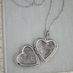 Heart floral locket necklace. Sterling silver plated locket measures 42x40mm. Chained in nickel free silver plated chain. Closes with a lobster clasp. ♥ All items carefully packaged in a pretty gift box -By purchasing this item you confirm that you have read and accept entire item description and my shop policies. Thanks for stopping by! Silver Metal Heart Necklace As Gift, Silver Metal Heart Necklace For Gift, Silver Pendant Locket Necklace Gift For Mom, Silver Pendant Locket Necklace As Gift For Mom, Silver Pendant Locket Necklace For Mom, Silver Heart Metal Necklace For Gift, Personalized Silver Locket Necklace For Mom, Silver Medallion Necklace As Gift For Mom, Nickel Free Silver Heart Necklace Gift