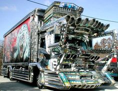 a large semi truck decorated with metal parts