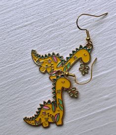 Floral Dinosaur Earrings Cute Dino Earrings for Gift Idea - Etsy Yellow Novelty Earrings With Ear Wire, Novelty Yellow Earrings With Ear Wire, Fun Nickel-free Metal Jewelry, Handmade Fun Metal Jewelry, Fun Handmade Metal Jewelry, Playful Metal Jewelry For Gifts, Playful Metal Jewelry Gift, Playful Metal Jewelry As A Gift, Fun Handmade Gold Earrings