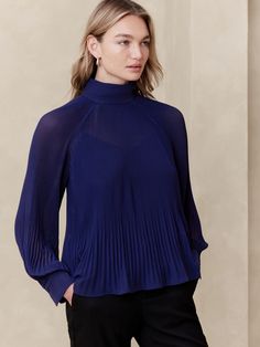 Pleated Volume-Sleeve Blouse | Banana Republic Factory Classic Pleated Office Tops, Elegant Fall Tops With Back Button Closure, Elegant Turtleneck Top For Evening, Chic Pleated Stretch Top, Chic Blue Tops With Pleated Sleeves, Pleated Blouse For Workwear, Elegant Blue Blouse With Pleated Sleeves, Elegant Pleated Top For Workwear, Chic Pleated Tops For Work