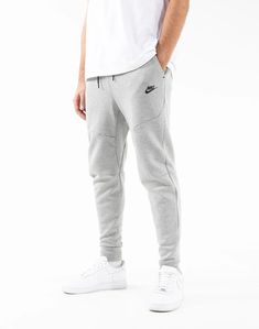 Nike Gray Joggers For Gym, Nike Joggers For Sports, Nike Urban Sports Bottoms, Urban Gray Sports Bottoms, Gray Urban Sport Bottoms, Urban Gray Bottoms For Sports, Solid Color Sports Sweats With Pockets, Nike Sporty Gray Joggers, Nike Gray Joggers For Sports