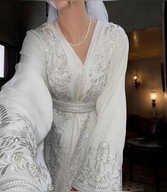 Moroccan White Caftan, White Luxury Embroidered Wedding Dress - Bridal Gown with Intricate Details, Romantic Elegance, Handcrafted Beauty, Elegant White Wedding Dress For Ceremony, Floral Embroidered V-neck Wedding Gown, Traditional V-neck Wedding Gown, White Ceremony Dress With Pearl Embroidery, White Pearl Embroidered Dress For Ceremony, White Dress With Pearl Embroidery For Ceremony, Long Sleeve Dresses With Intricate Embroidery For Wedding, Floor-length Embroidered Wedding Dress, Ceremony White Dress With Intricate Embroidery