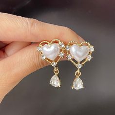 Romantic princess style fancy heart shape chunky white pearl stud earrings with 14K gold plated lace and teardrop cz dangle drop, super cute and luxurious! Unique design will bring you lots of compliments on every occasion, perfect bridal bridesmaids bridal wedding earrings. Handmade of 925 sterling silver, hypoallergenic and good for sensitive skins. ♥ All of our jewelry are carefully handmade with delicate and exquisite details, all designed and made in Manhattan, New York. 💎 Features: ♥ Hand Luxury Heart Earrings For Wedding, Luxury Statement Teardrop Pearl Earrings, Luxury Pearl Drop Dangle Bridal Earrings, Luxury White Teardrop Pearl Earrings, Luxury Teardrop Pearl Jewelry, Luxury Romantic Heart Earrings For Wedding, Luxury Sterling Silver Heart Earrings For Wedding, Luxury White Heart-shaped Earrings, Girly Jewelry Pearl