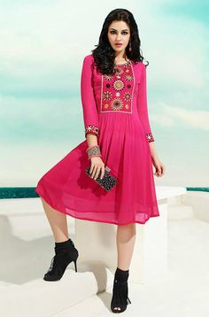 This cute pink georgette kurti features an embroidered pattern on the front and the sleeves adding grace to the outfit, perfect for day or night wear. Available as stitched (ready-to-wear). Note: There might be a slight color variation due to lighting and flash used during photoshoot. The bright shade seen is the best closer view of fabric's color. Designer Embroidered Neckline Dress For Diwali, Bollywood Style Kurta With Embroidered Neckline For Diwali, Anarkali Salwar Kameez With Embroidered Neckline For Eid, Anarkali Embroidered Dress With Embroidered Neckline For Eid, Bollywood Style Dress With Embroidered Neckline For Navratri, Bollywood Dresses With Embroidered Neckline For Navratri, Festive Bollywood Salwar Kameez With Embroidered Neckline, Unstitched Kurta With Embroidered Sleeves For Navratri, Festive Georgette Kurta With Embroidered Neckline