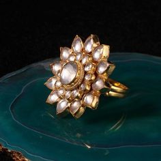 White Flower Ring Riana by Shikha Jindal - Fabilicious Fashion Traditional Gold Flower Ring For Festive Occasions, Traditional Yellow Gold Flower Ring For Gift, Traditional Yellow Gold Flower Ring As Gift, Traditional Yellow Gold Flower Ring Gift, Traditional Yellow Gold Flower Ring, Festive Gold Jewelry With Flower Decoration, Jadtar Ring, White Flower Ring, Kundan Ring