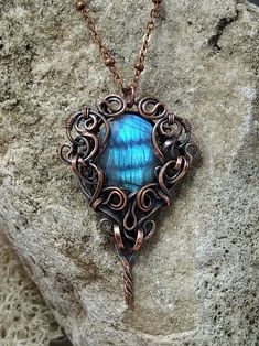 Made with faceted teardrop labradorite gemstone with bright blue shine. The stone has a hole in it so it's securely attached. The color of the shine is rich blue like late evening sky with some clouds on it. If you move the pendant, the fire inside the stone moves similar to light in a holographic picture. Flat solid copper wire for the pendant I made myself. It also required some soldering.  Chain is also solid copper with adjustable length (18 - 20 inches), I can make it even longer or shorter Copper Teardrop Wire Wrapped Jewelry, Wire Wrapped Teardrop Copper Jewelry, Silver Teardrop Jewelry With Copper Wire, Silver Teardrop Jewelry In Copper Wire, Teardrop Copper Wire Wrapped Jewelry, Artisan Labradorite Wire Wrapped Jewelry, Unique Copper Teardrop Jewelry, Hand Wrapped Copper Teardrop Jewelry, Unique Copper Teardrop Pendant Jewelry