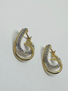 "This is a classic, vintage pair of 10K yellow gold, 10K white gold, and diamond loop-design dangle/drop earrings. Material(s): 10K yellow gold + 10K white gold + several small diamonds Total weight: 3.4 grams Flaws (if any): None to mention Marking(s): \"10K\" If you have any questions about this pair of earrings, please do not hesitate to contact us! ♥" Classic Gold Diamond Earrings Hallmarked, Classic Gold Hallmarked Diamond Earrings, Hallmarked Pear-shaped White Gold Diamond Earrings, Yellow Gold Drop Hoop Earrings For Anniversary, Pear-shaped Hallmarked White Gold Diamond Earrings, Anniversary Yellow Gold Drop Hoop Earrings, Gold Diamond Earrings Stamped 14k For Anniversary, Vintage Gold Diamond Earrings With Brilliant Cut, Gold Drop Diamond Earrings With Prong Setting