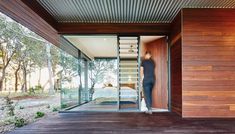 a person standing in the doorway of a house