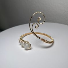 Wrist Cuff Gold Asymmetrical Swirly Design Glass Beads Arm Band Wire Wrapped Adjustable Minimalist Bracelet - Etsy Elegant Adjustable Beaded Bangle, Elegant Adjustable Spiral Bracelet, Modern Twist Adjustable Bangle As A Gift, Adjustable Bangle With A Modern Twist As A Gift, Adjustable Bangle With A Modern Twist For Gifts, Elegant Spiral Wire Wrapped Bracelet, Elegant Spiral Wire Wrapped Bracelets, Elegant Wire Wrapped Spiral Bracelets, Adjustable Modern Twist Cuff Bangle Bracelet