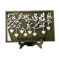 a family tree with hearts hanging from it's branches and the words, our family