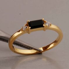 "Minimalist Ring, 18k Gold Vermeil, Black Onyx Baguette Ring, Engagement Ring, Stacking Ring, Black Onyx Ring, Dainty Ring, Rings For Women  SHOP LINK:- https://www.etsy.com/shop/MaaShabashibaJewell?ref=seller-platform-mcnav 》D E T A I L S《 Gemstone: Natural Black Onyx                  Gem Color: Black                      Gem Shape: Baguette                         Gem Category: Cut                    Metal: 925 Sterling Silver Purity: 925 Parts Per 1000 Setting Type: Prong Set Silver Polish: High Ring Size: All Size Available Please note that there Can be slight variations in stone texture and color shades in the actual product that you receive. The stone quality or grade will be the same. Because We Use Natural Stones And All Natural Stones Are Not Of Same Textured. All Our Jewelry Is 9 Baguette Ring Engagement, Engagement Ring Stacking, Rings Couple, Engagement Rings Couple, Black Gold Ring, Black Gems, Zierlicher Ring, Baguette Ring, Silver Polish