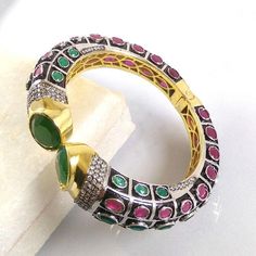 This Listing is for 1 Piece Beautiful Red Aventurine,Green Onyx & CZ Hydro Gemstone 24k Gold Plated Cuff Bangle Bracelet Jewelry Gemstone: Red Aventurine,Green Onyx & CZ Metal : Brass Style : Cuff Bracelet Size : Cuff Adjustable Size Plating : 24k Gold Plated & Black Oxidize Color : Green,Yellow,White,Red Note : We Ship Parcel Via India Post Economy Shipping It's Take 20 To 25 Days To Arrive. Check my other items frequently. I will be adding to the inventory regularly. Be sure to vis Multicolor Stone Set Bangle Bracelets, Stone-embedded Bangle Cuff Bracelet For Gift, Multicolor Stone Setting Bangle Bracelet, Stone Bangle Cuff Bracelet For Gift, Stone Cuff Bracelet Bangle As A Gift, Festive Gemstone Bangle Bracelets, Stone-embellished Bangle Cuff Bracelet For Gift, Red Gemstone Bangle Cuff Bracelet, Red Gemstone Cuff Bracelet