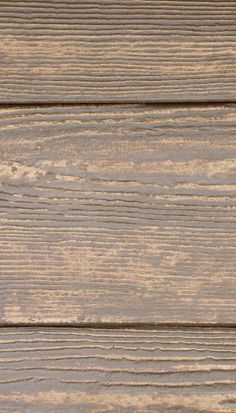 an image of wood planks that are painted in light brown and beige colors with white trim