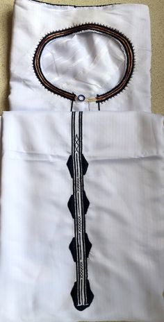 The Ugandan traditional original Kanzu -Carefully made with silken - cotton material  -to suit traditional/formal ocassion. Size for young age from 18 - 30 years Classic Fitted Cotton Kurta, Ceremonial White Kurta With Traditional Fit, Traditional White Thobe With Patterns, White Traditional Fit Kurta For Ceremonies, Fitted White Kurta With Traditional Patterns, White Fitted Kurta With Traditional Patterns, Traditional Fitted Agbada For Formal Occasions, Ceremonial Cotton Kurta For Festivals, Cotton Kurta For Ceremonial Festivals