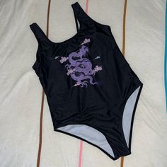 Euc; Washed Never Worn. Casual Purple One-piece Swimwear, Black Printed Bodysuit For Pool, Printed Black Bodysuit For Pool, Black Printed Bodysuit For Beach Season, Printed Black Bodysuit For Beach Season, Purple One-piece Swimming Bodysuit, Purple One-piece Bodysuit For Swimming, Casual Printed Purple Swimwear, Casual Purple Printed Swimwear