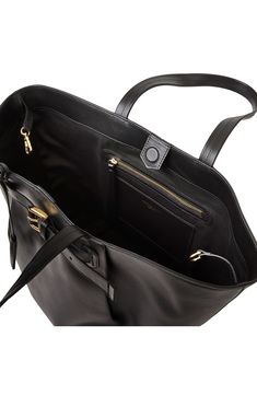 A gleaming buckled strap and soft pleats frame the front of an Italian-crafted bag in a versatile and spacious silhouette. 23" x 14" x 8.5" 11.5" strap drop Two top handles Magnetic top closure Lined Leather/textile Made in Italy Luxury Bags With Buckle Closure For Work, Luxury Workwear Bags With Buckle Closure, Black Designer Bags With Buckle Closure, Designer Black Bags With Buckle Closure, Classic Black Bag With Buckle Closure, Elegant Top Handle Bag With Buckle Closure, Formal Top Handle Bag With Buckle Closure, Elegant Shoulder Bag With Buckle Closure And Top Handle, Luxury Office Bags With Buckle Closure