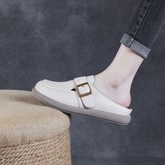 Gender: Women Type: Mules Main Materials: Cowhide Insole: Sheepskin Sole: Rubber Type of Closure: Slip-on Style: Daily. Casual. Retro Season: Spring. Summer. Autumn Heel Height: Low (2.5 cm) Beige Mules With Buckle Closure And Round Toe, Beige Round Toe Mules With Buckle Closure, Cream Leather Flat Slip-ons, Beige Mules With Leather Footbed And Round Toe, Beige Slip-on Mules With Round Toe, Beige Leather Slip-ons For Spring, Beige Slip-on Mules With Buckle Closure, Beige Flat Bottom Slip-ons, Beige Buckle Closure Slip-on Mules