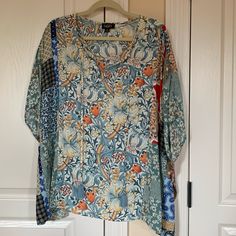 New Never Worn Poncho Style Top. Has Blue Tassel Ties In The Front. 24” Long. Hangs Lower On The Sides. 36” Pit To Pit. Nice Soft Fabric. Blue Tunic Tops For Fall, Blue Casual Tunic With Relaxed Fit, Casual Multicolor Tie Neck Tops, One Size Multicolor Floral Print Tops, Blue Relaxed Fit Tunic Blouse, One Size Long Sleeve Tops With Floral Print, Patterned One Size Tops For Spring, One Size Floral Print V-neck Top, Blue Short Sleeve Casual Tunic