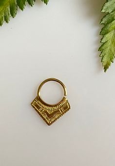 "African edgy piercing septum ring is inspired by the tribal Tuareg jewelry. The ethnic triangle nose ring will add statement detail to your boho outfit. Each piece is hand made and hand carved to offer a unique piece to adorn yourself. Material: brass Gauge 18 oooooooooo See more here : https://www.etsy.com/shop/Saajie oooooooooo ✩ WRAPPING ✩ Gift- Ready !! ✩ Your septum ring will come in a beautiful handmade cotton and recycled silk from Indian Saree pouch. Ideal for gifts or just storing your Traditional Gold Septum Ring Gift, Septum Piercing Jewelry Indian, South Indian Septum Ring, Indian Septum Ring, Gold Bohemian Nickel-free Septum Ring, Tuareg Jewelry, Septum Hoop, Indie Jewelry, Sterling Silver Bangle Bracelets