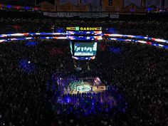 an overhead view of a basketball game in the middle of a stadium with people watching