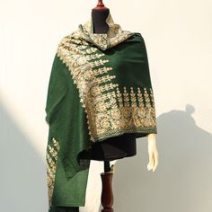 Deep green high-quality embroidered Kashmiri pashmina wool shawl. The perfect deep green color layered with detailed beige color border embroidery. This shawl is ideal to be paired with neutral or colored outfits this winter season. This piece is fully embroidered by machine and in a medium length, ideal for pairing with basic single-tone outfits. Perfect for formal occasions to add a pop of color to your outfits. The perfect medium-length shawl to pair with both eastern and western outfits. ideal for both indoor and outdoor use for a variety of occasions. Each piece is uniquely crafted and available in limited quantity and sizing. Ideal gift Weddings, Anniversaries, Birthdays and other occasions & celebrations. A thoughtful Valentines Day gift for Her. Ideal gift Weddings, Anniversaries, Kashmiri Pashmina Shawl, Fall Wraps, Eid Dress, Eid Dresses, Blue Embroidery, Dress Silk, Boho Fall, Wool Shawl, Pashmina Shawl