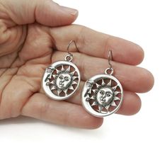 Free shipping Canada & USA with $35 purchase. Unique sun and moon celestial statement earrings. - Assembled with pure titanium ear wires (G1). Titanium is 100% hypoallergenic and will not produce skin irritation or discoloration. - Tibetan style alloy pendant measuring 30 x 26mm (cadmium free, nickel free & lead free) - Silicone stoppers included. Celestial Silver Pierced Jewelry, Celestial Style Silver Jewelry, Spiritual Style Silver Jewelry For Summer, Celestial Style Pierced Sterling Silver Jewelry, Hypoallergenic Celestial Round Earrings, Symbolic Hypoallergenic Metal Jewelry, Adjustable Metal Sun And Moon Jewelry, Dangle Earrings With Sun And Moon Design For Gift, Sun And Moon Design Dangle Earrings For Gift