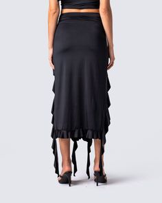 Owning an entire room has never been easier 😏 Rock your darker side with this sultry black jersey skirt. Complete with a high-waisted fit, shirring at the waist and hips, and front cutout detailing with a cascading ruffle hem 🖤 Black Ruched Bottoms For Evening, Summer Party Maxi Skirt In Elastane, Black Ruched Draped Skirt For Evening, Chic Black Draped Skirt With Ruched Detail, Chic Black Ruched Draped Skirt, Black Ruched Maxi Skirt For Summer, Elegant Black Ruched Bottoms, Flowy Ruched Maxi Skirt For Night Out, Chic Black Draped Skirt With Gathered Detail