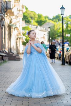 Blue flower girl dress with multilayered skirt, the satin corset with sequins and butterfly lace, decorated with the detachable сape.  The dress fastens with a vertical corset and zipper. Specially designed of unique girls dress pattern for your chic special occasions, wedding, birthday, first communion, pageant, bridesmaid party, Christmas. Item material: upper layer of the skirt - satin and seqiuns lace, zipper middle layer of the skirt - tulle lower layer of the skirt - taffeta corset - satin Flower Girl Wedding Dress, Girl Wedding Dress, Blue Flower Girl, Wedding Dress Tulle, Unique Girls, Flower Girl Dresses Blue, Flower Girl Wedding, Butterfly Lace, Skirt Satin