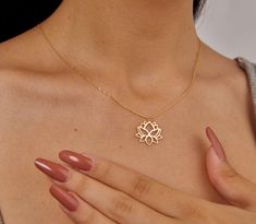 This beautiful Gold Lotus Flower Necklace is a perfect blend of elegance and spirituality. Crafted with a delicate 14K gold-plated lotus pendant, it's a meaningful accessory for those who appreciate both style and mindfulness. The lotus flower, a symbol of purity and rebirth, makes this necklace ideal for meditation, yoga, and a boho-chic aesthetic. Whether you're searching for a unique gift for a loved one or a special treat for yourself, this dainty necklace is versatile enough for everyday wear and special occasions. Its minimalist design allows it to layer beautifully with other pieces, or shine elegantly on its own. Key Features: -- Material: 14K gold-plated for durability and a lasting shine. -- Design: Intricate lotus flower symbol representing growth and resilience. -- Size: Chain Lotus Flower Symbol, Gold Lotus Flower, Lotus Flower Necklace, Meditation Accessories, Flower Symbol, Lotus Pendant, Gold Lotus, The Lotus Flower, Chic Aesthetic