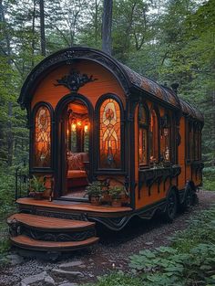 an orange train caboose with stained glass windows