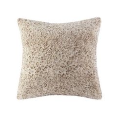 an animal print pillow on a white background