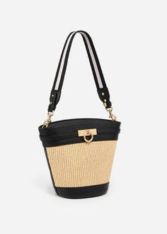 The timeless and trend-setting design of the Madison Bucket Bag is a must-have. It can be worn by its adjustable, removable shoulder strap or elegantly draped over your shoulder with an alternative woven strap. With its spacious interior, it's a wardrobe staple for your everyday adventures.