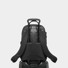 Tumi backpack is made of carbon fiber, leather, and polyester  Zip opening to main compartment Magnetic zipper pulls Zip entry to laptop compartment Luggage tag Top carry handle Add-a-Bag sleeve Built-in USB port  Two elastic open pockets Back open pocket; magnetic snap closure  Keyring Card pocket Two open pockets Padded tablet pocket TUMI Tracer® Approx. 9"L x 12"W Lining: Polyester Spot clean Imported Modern Laptop Bag With Anti-theft Pocket For On-the-go, Modern Travel Accessories With Functional Pockets, Modern Nylon Travel Accessories For Commuting, Functional Travel Backpack For Business Trips, Modern Travel Bag With Functional Pockets, Modern Nylon Travel Bag With Functional Pockets, Modern Commuting Luggage Backpack, Modern Commuting Backpack Luggage, Functional Leather Backpack