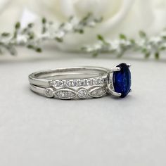 This beautiful ring is made from genuine 925 sterling silver with rhodium plating. Ring details- -The Main stone is an oval cut 8mm by 6mm Lab Created Blue Sapphire Stone -Side stones are 1.2 Round simulated diamonds -Ring is casted in solid 925 sterling silver with rhodium plating (yellow gold and rose gold plated also available, please check the drop down menu for more options) -The Total face height of the ring measures 8mms and the band width measures 2mms -Each ring is handmade and made to Stackable Rings With Diamond Accents For Gifts, Oval Stackable Rings In White Gold And Sterling Silver, Oval Stackable Rings With Diamond Accents For Promise, Oval Cubic Zirconia Stackable Rings In Fine Jewelry Style, Oval Stackable Fine Jewelry Rings For Anniversary, Fine Jewelry Oval Stackable Rings For Anniversary, Oval Stackable Rings With Diamond Accents For Anniversary, Oval Stackable Rings For Anniversary, Oval Cubic Zirconia Stackable Rings