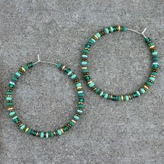 "Handmade, beaded, boho hoop earrings. * DETAILS: ‣ various Czech and Japanese glass seed beads ‣ colors: turquoise, pine green, bronze, gold, olive, grey ‣ carefully handmade, polished earring hoops (316L grade stainless steel) * SIZE: ‣ approx Ø: 1.7\" / 4.3 cm ‣ size of the beads: 3 mm Click here for more beaded hoop earrings: www.etsy.com/shop/LianuDesign?ref=seller-platform-mcnav%C2%A7ion_id%C2%A7ion_id§ion_id=26956662 Or check out all items in the shop: www.etsy.com/shop/LianuDesign" Bohemian Small Hoop Heishi Bead Earrings, Bohemian Heishi Beads Small Hoop Earrings, Green Bohemian Beaded Hoop Earrings, Nickel-free Hoop Earrings With Heishi Beads, Bohemian Green Wire Wrapped Hoop Earrings, Bohemian Heishi Beads Hoop Earrings, Bohemian Heishi Beads Hoop Earrings As Gift, Bohemian Hoop Earrings With Heishi Beads, Bohemian Hoop Beaded Earrings With Heishi Beads