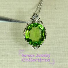 Very pretty Peridot pendant necklace, set with diamonds and in platinum. This peridot is fine quality and a large 13.62 carats in weight and very gemmy clean! The necklace is 18 inch maximum adjustable to any smaller length. A few diamonds adorn the sides of the peridot. Total Weight: 11.71 grams Face Size: 1 inch x 0.7 inch Precious Metal: Platinum (pendant and chain necklace) Precious stones: -Peridot Center Stone: 13.62 carats, 16mm x 13.8mm -White Diamonds: 0.29 carats Hallmarks: Pt900, 13.6 Wedding Jewelry With Brilliant Cut Peridot, Luxury Oval Tsavorite Jewelry, Exquisite Green Necklace With Brilliant Cut, Luxury Peridot Jewelry For Formal Occasions, Green Oval Necklace For Formal Occasions, Formal Green Oval Necklace, Anniversary Peridot Jewelry With Diamond Accents, Elegant Oval Tsavorite Jewelry, Green Peridot Necklace In Fine Jewelry Style