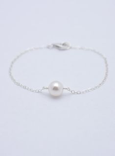 LISTING IS FOR ALL 4 PEARL BRACELETS: This set of 4 sterling silver bracelets is hand-crafted using 8mm Swarovski pearls and solid sterling silver chain. Each measures approximately 7 inches long** and secures with a silver lobster clasp. Each comes in a gift box. Pearl also in ivory, pink, light grey, and dark grey. **IMPORTANT: Measures 7 inches long but can be made in any length. Please specify preferred length(s) at checkout. See measuring instructions here: www.etsy.com/listing/203218247/br Bridesmaid Bracelets, Bridesmaid Pearl Bracelet, Bridal Statement Necklace, Silver Pearl Bracelet, Silver Bridesmaid, Pretty Jewelry Necklaces, Bracelet Set Silver, Wedding Bridesmaid Jewelry, Pearl Bracelets