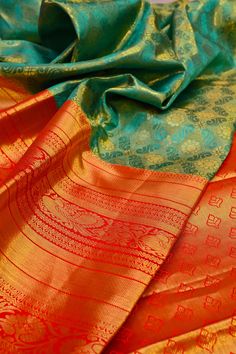 Do you think to buy the best and richness-filled kanjeevaram silk but with a twist element like the brocade? This turquoise green color kanjeevaram silk mark saree comes with brocade work and a broad border to make you party-ready any time. Color: A shade of turquoise green color Technique: This fabric comes with fantastic work of brocade and golden zari on the whole saree Fabric: Kanjeevaram Silk Quality: IndyVogue's Assurance of Silk Mark Certified Green Ceremonial Saree For Festive Occasions, Festive Green Ceremonial Saree, Turquoise Silk Saree With Zari Weaving, Green Lehenga With Motifs For Puja, Ceremonial Green Lehenga With Traditional Drape, Ceremonial Green Banarasi Silk Saree, Ceremonial Green Saree With Pallu, Ceremonial Green Saree With Cutdana, Ceremonial Green Paithani Silk Saree